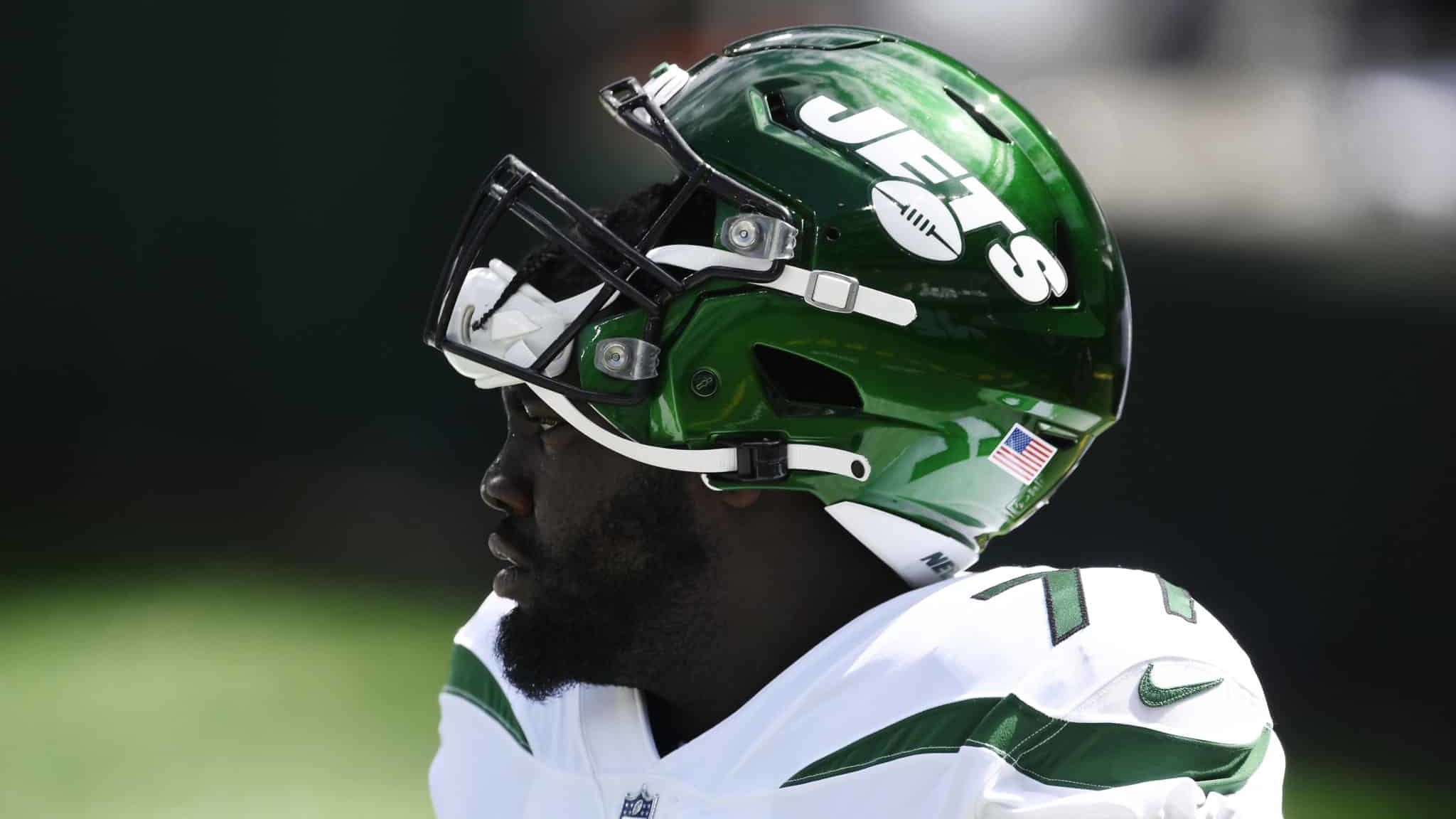 EAST RUTHERFORD, NEW JERSEY - SEPTEMBER 20: Mekhi Becton #77 of the New York Jets looks on during warmups before the game against the San Francisco 49ers at MetLife Stadium on September 20, 2020 in East Rutherford, New Jersey.