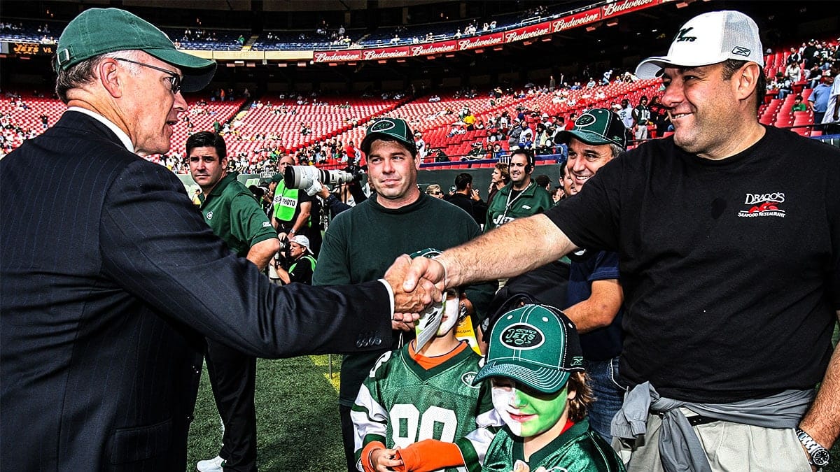 EAST RUTHERFORD, NEW JERSEY--OCTOBER 01: James Gandolfini meets with New York Jets owner Woody Johnson when he attends the New York Jets vs Indianapolis Colts game at The Meadowlands (aka Giants Stadium) on October 1, 2006 in East Rutherford, New Jersey.