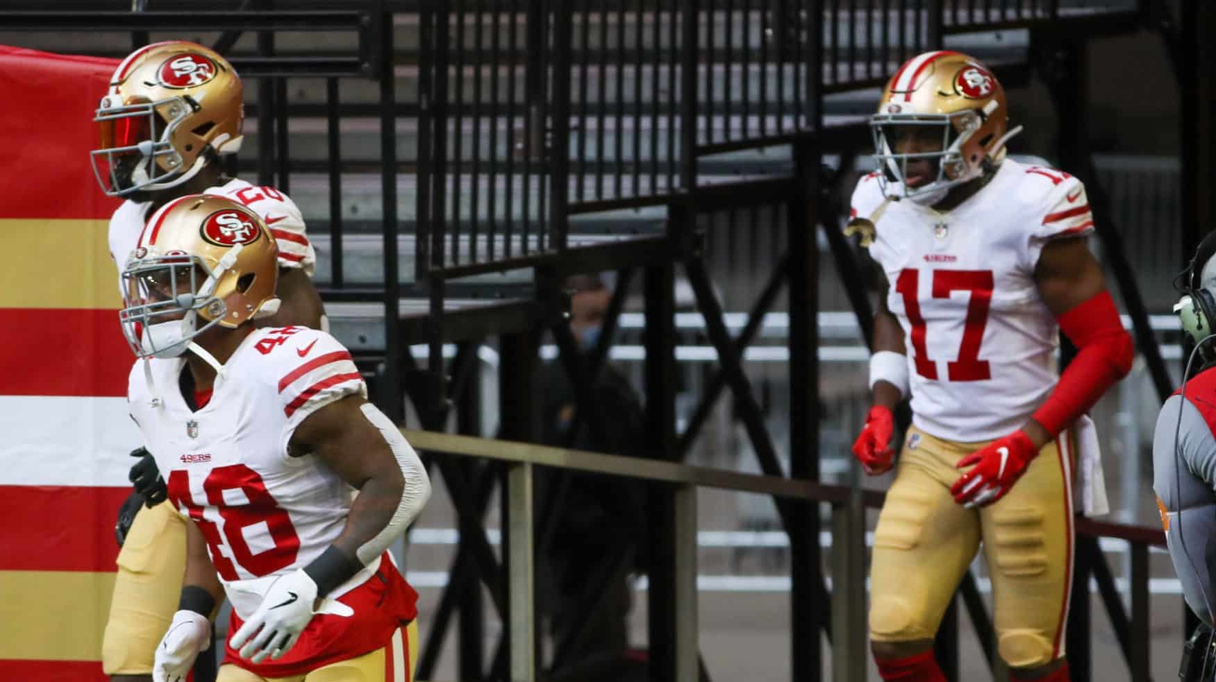 GLENDALE, AZ - JANUARY 03: San Francisco 49ers Running Back Austin Walter (48), Safety Jimmie Ward (20), and Wide Receiver Matt Cole (17) run to field prior to a game against the Seattle Seahawks at State Farm Stadium on January 3, 2021 in Glendale, Arizona.