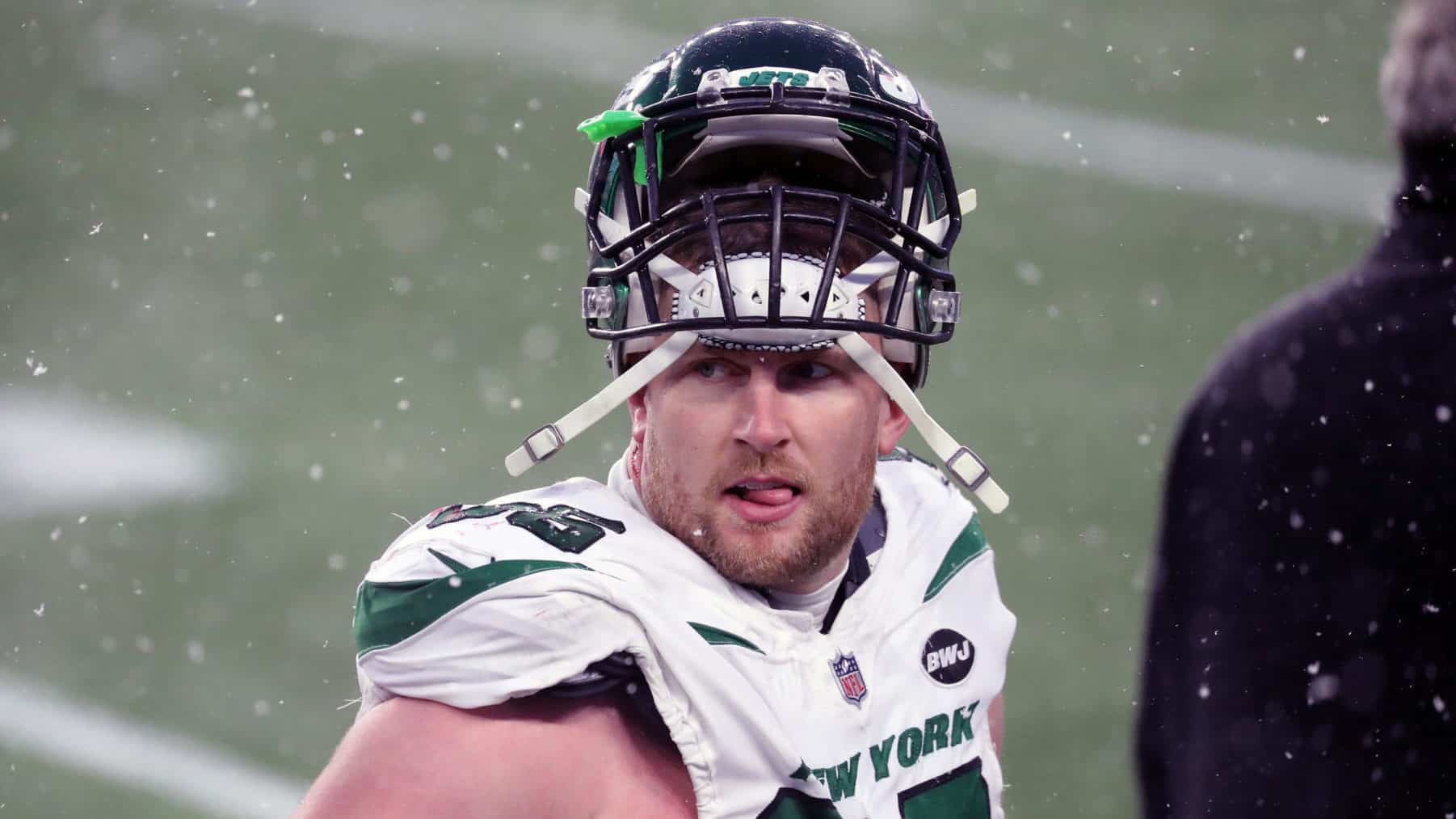FOXBOROUGH, MA - JANUARY 03: Henry Anderson #96 of the New York Jets follows the action in the snow against the New England Patriots at Gillette Stadium on January 3, 2021 in Foxborough, Massachusetts.