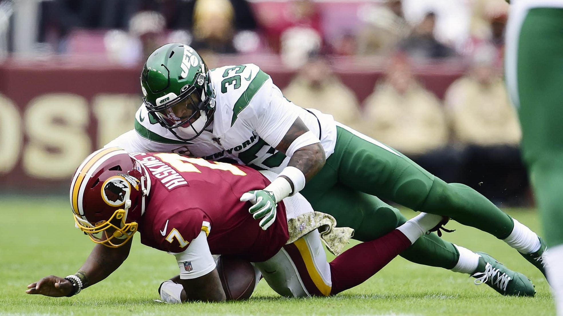 LANDOVER, MD - NOVEMBER 17: Dwayne Haskins #7 of the Washington Redskins is sacked by Jamal Adams #33 of the New York Jets at the end of the first half at FedExField on November 17, 2019 in Landover, Maryland.