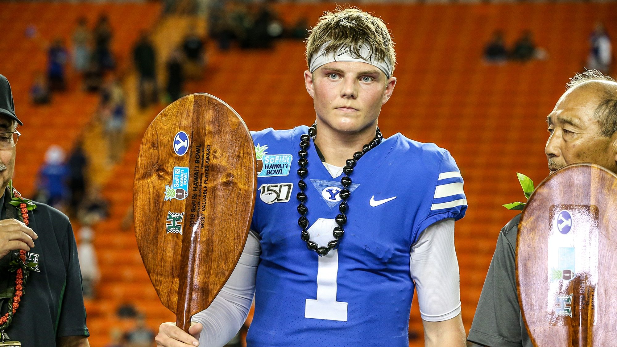 HONOLULU, HI - DECEMBER 24: Zach Wilson #1 of the BYU Cougars holds the MVP trophy at the Hawai'i Bowl at Aloha Stadium on December 24, 2019 in Honolulu, Hawaii.