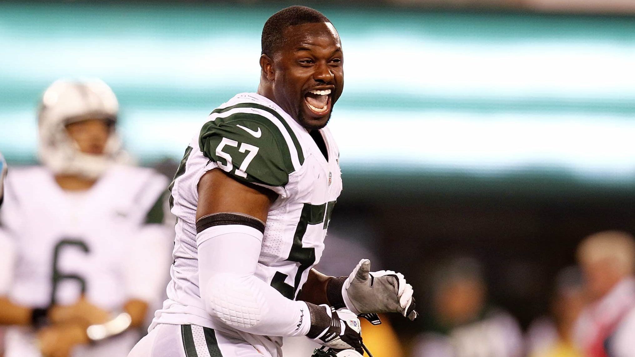 EAST RUTHERFORD, NJ - AUGUST 26: Bart Scott #57 of the New York Jets reacts during a preseason game against the Carolina Panthers at MetLife Stadium on August 26, 2012 in East Rutherford, New Jersey.