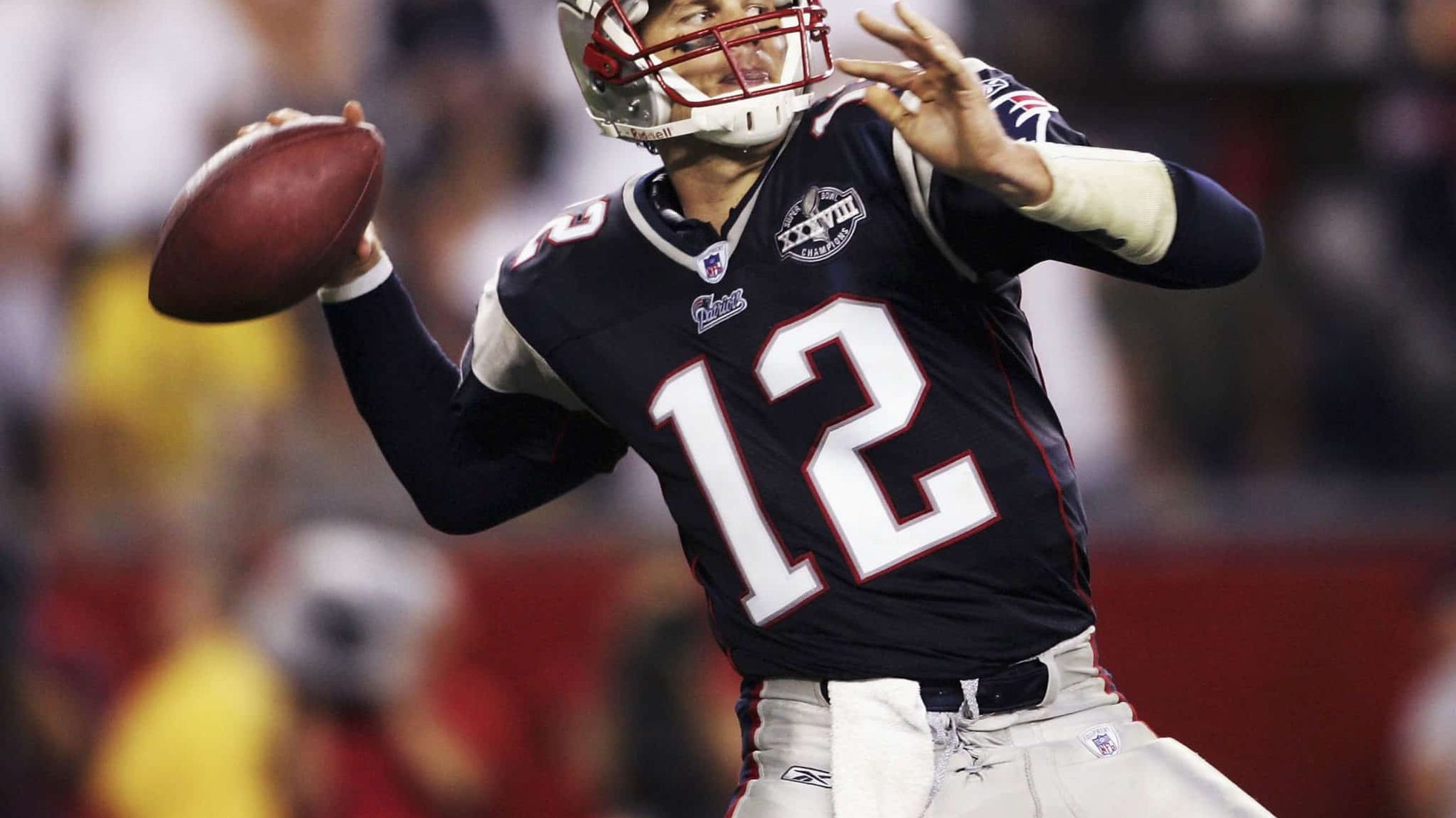 FOXBORO, MA - SEPTEMBER 9: Tom Brady #12 of the New England Patriots throws a pass against the Indianapolis Colts during the NFL game at Gillette Stadium on September 9, 2004 in Foxboro, Massachusetts.