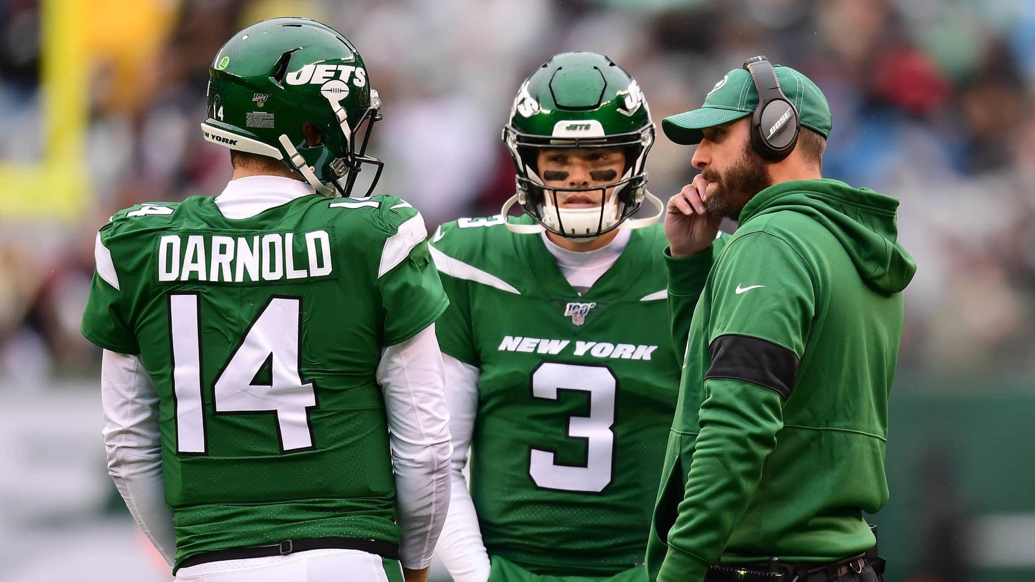 EAST RUTHERFORD, NEW JERSEY - NOVEMBER 24: New York Jets head coach Adam Gase talks to Sam Darnold #14 and David Fales #3 during the second quarter of their game against the Oakland Raiders at MetLife Stadium on November 24, 2019 in East Rutherford, New Jersey.