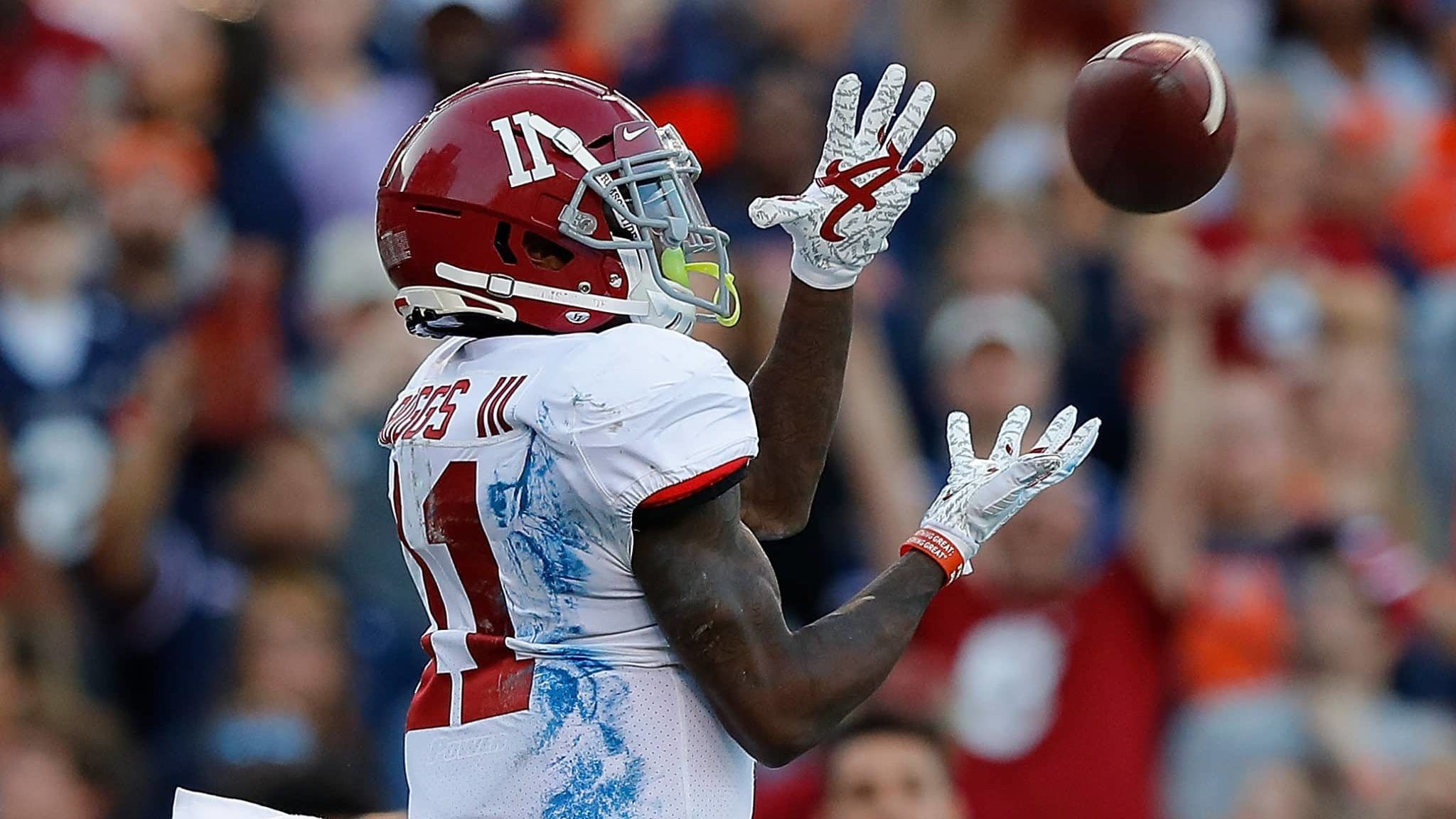 AUBURN, ALABAMA - NOVEMBER 30: Henry Ruggs III #11 of the Alabama Crimson Tide pulls in this touchdown reception against the Auburn Tigers in the first half at Jordan Hare Stadium on November 30, 2019 in Auburn, Alabama.