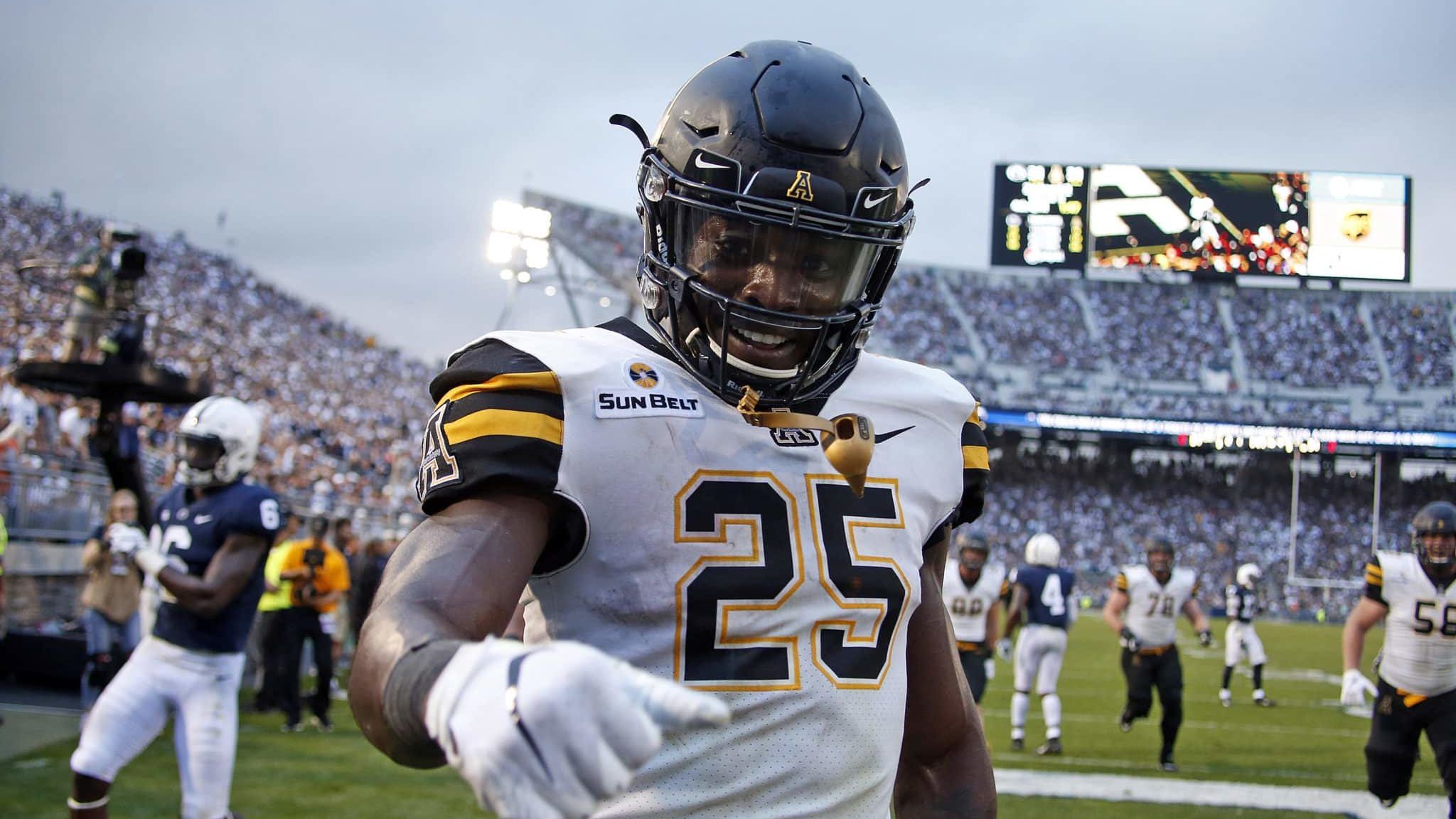STATE COLLEGE, PA - SEPTEMBER 01: Jalin Moore #25 of the Appalachian State Mountaineers celebrates after rushing for a 16 yard touchdown in the fourth quarter against the Penn State Nittany Lions on September 1, 2018 at Beaver Stadium in State College, Pennsylvania.