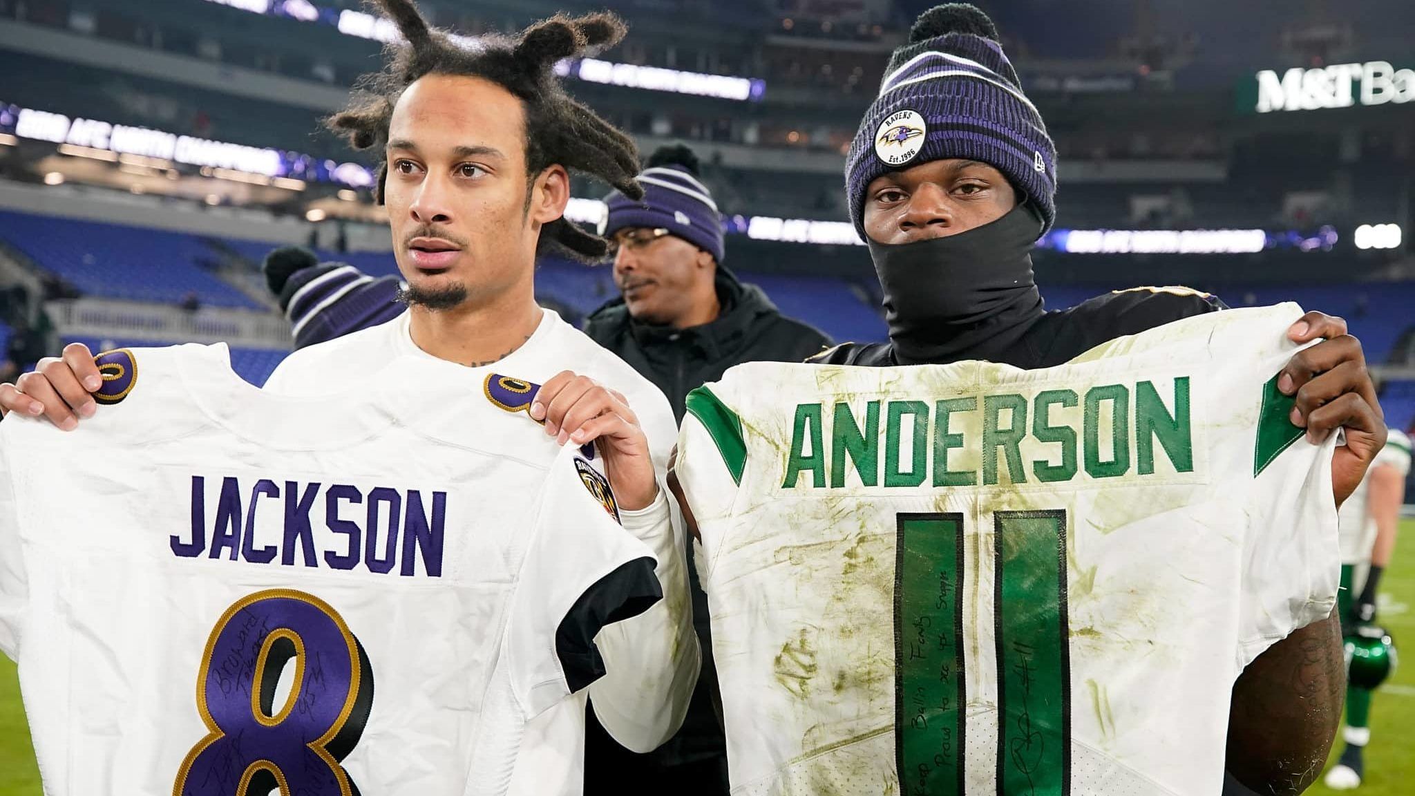 BALTIMORE, MARYLAND - DECEMBER 12: Quarterback Lamar Jackson #8 of the Baltimore Ravens and wide receiver Robby Anderson #11 of the New York Jets exchange jerseys after the game at M&T Bank Stadium on December 12, 2019 in Baltimore, Maryland.The Baltimore Ravens win 42-21 over the New York Jets