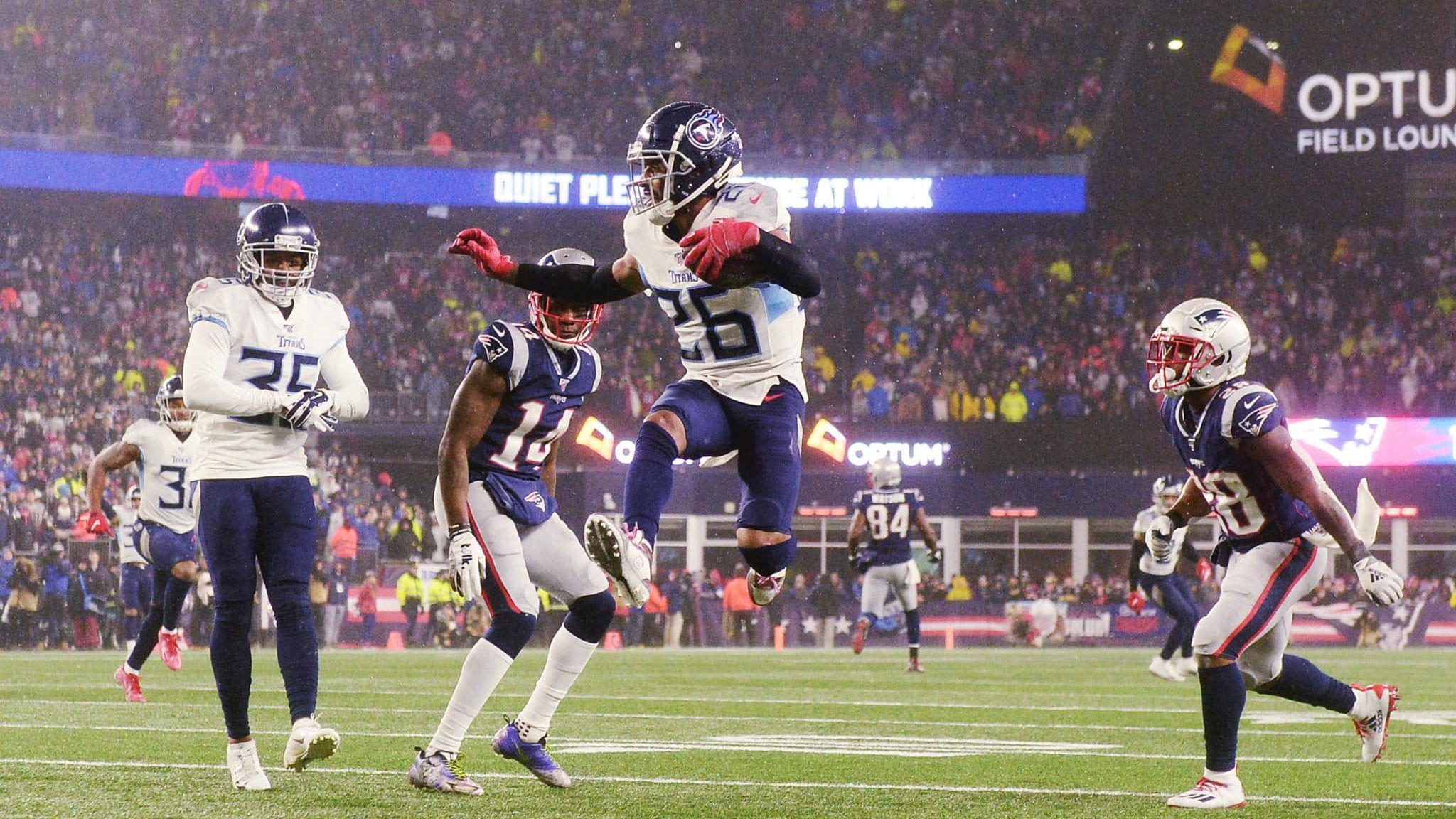 FOXBOROUGH, MASSACHUSETTS - JANUARY 04: Logan Ryan #26 of the Tennessee Titans carries the ball to score a touchdown against the New England Patriots in the fourth quarter of the AFC Wild Card Playoff game at Gillette Stadium on January 04, 2020 in Foxborough, Massachusetts.