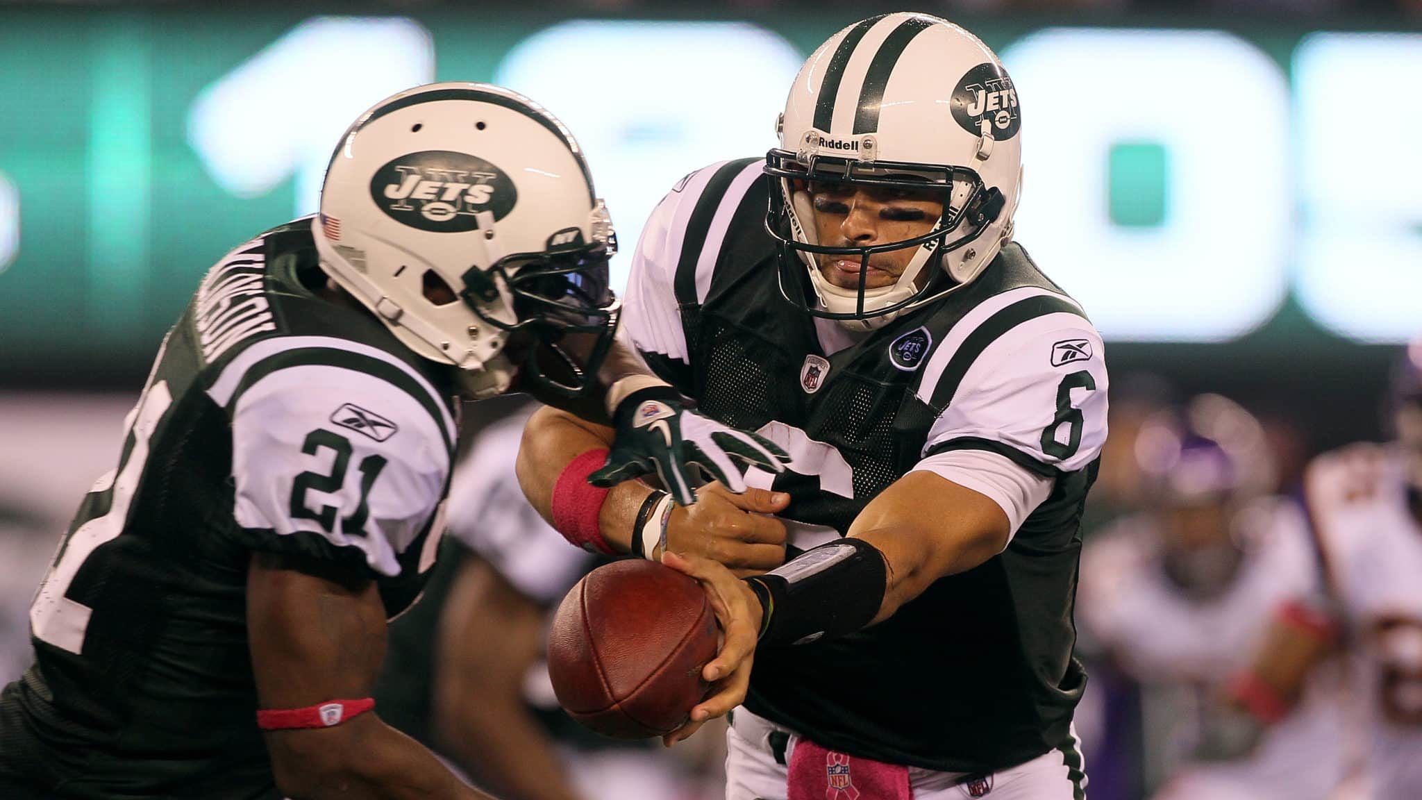 EAST RUTHERFORD, NJ - OCTOBER 11: Quarterback Mark Sanchez #6 of the New York Jets hands the ball off to LaDainian Tomlinson #21 against the Minnesota Vikings at New Meadowlands Stadium on October 11, 2010 in East Rutherford, New Jersey.