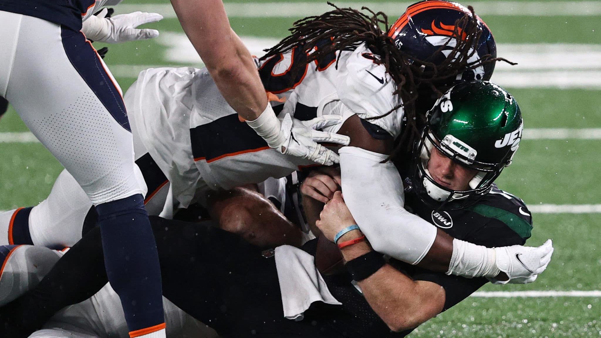 EAST RUTHERFORD, NEW JERSEY - OCTOBER 01: A.J. Johnson #45 of the Denver Broncos sacks Sam Darnold #14 of the New York Jets during the third quarter at MetLife Stadium on October 01, 2020 in East Rutherford, New Jersey.