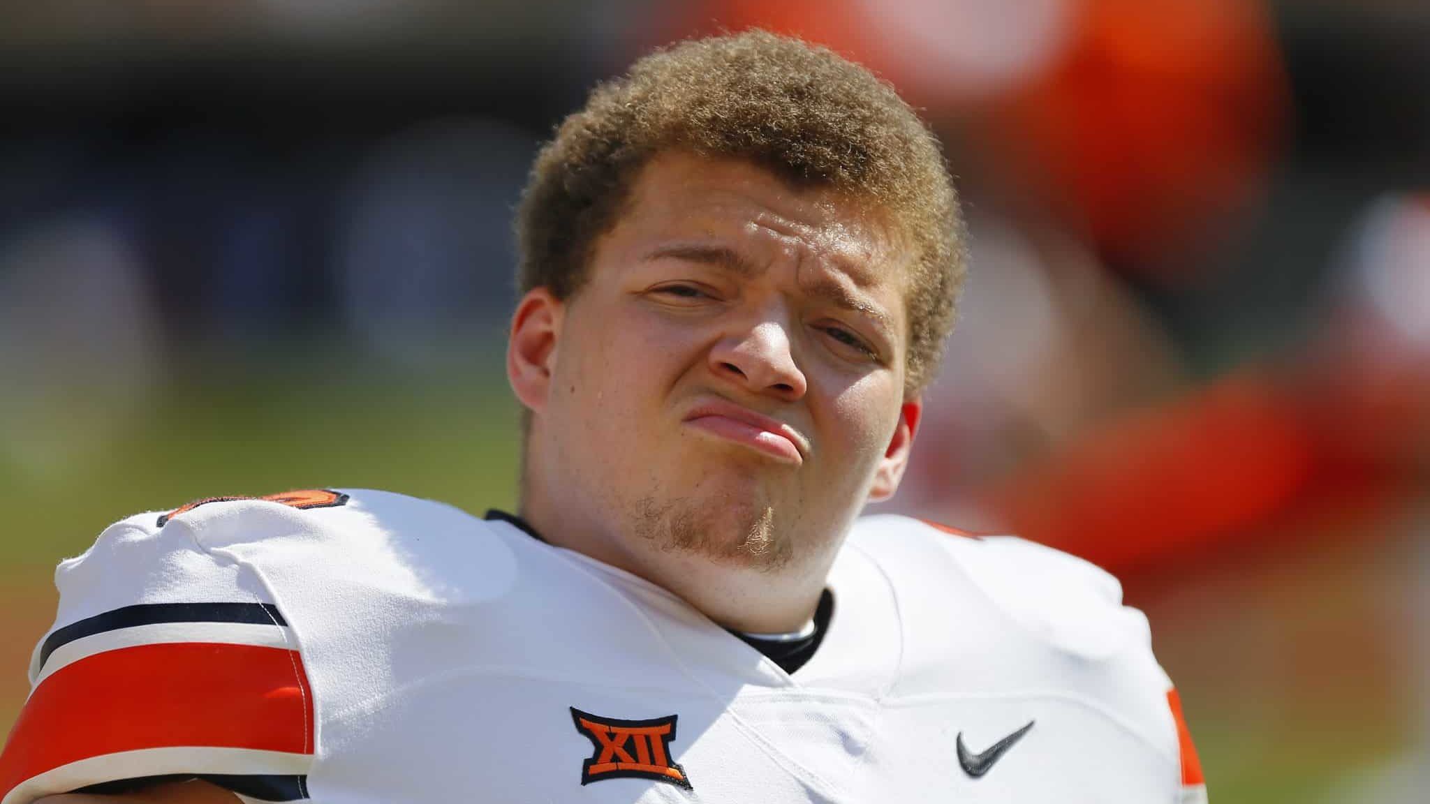 STILLWATER, OK - SEPTEMBER 26: Offensive lineman Teven Jenkins #73 of the Oklahoma State Cowboys stretches before a game against the West Virginia Mountaineers on September 26, 2020 at Boone Pickens Stadium in Stillwater, Oklahoma. OSU won 27-13.