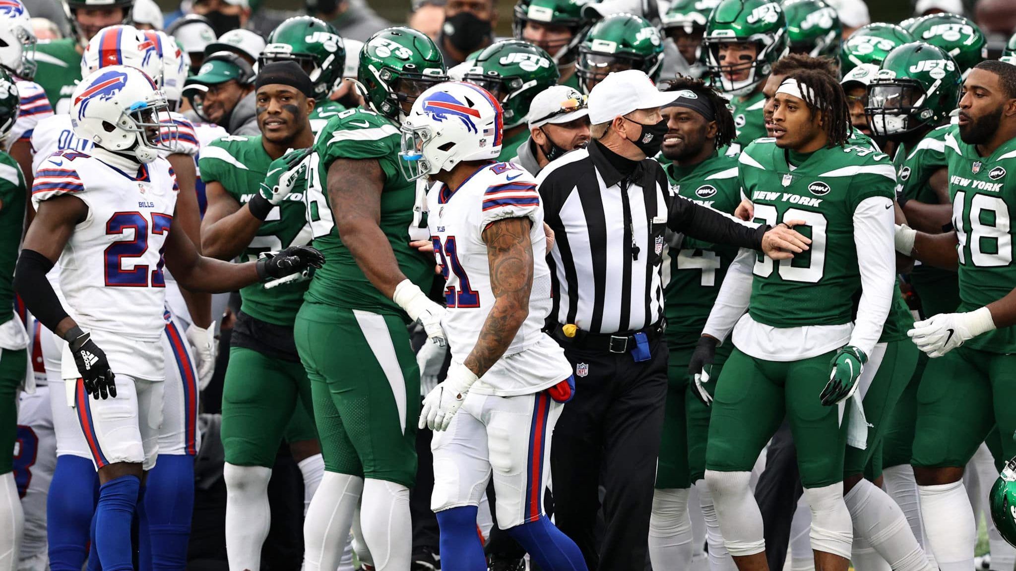 EAST RUTHERFORD, NEW JERSEY - OCTOBER 25: Players from the Buffalo Bills and the New York Jets are separted by the referee after Micah Hyde #23 of the Buffalo Bills tackled Breshad Perriman #19 of the New York Jets during a play in the fourth quarter of the game at MetLife Stadium on October 25, 2020 in East Rutherford, New Jersey. Perriman went to the locker room after the play.