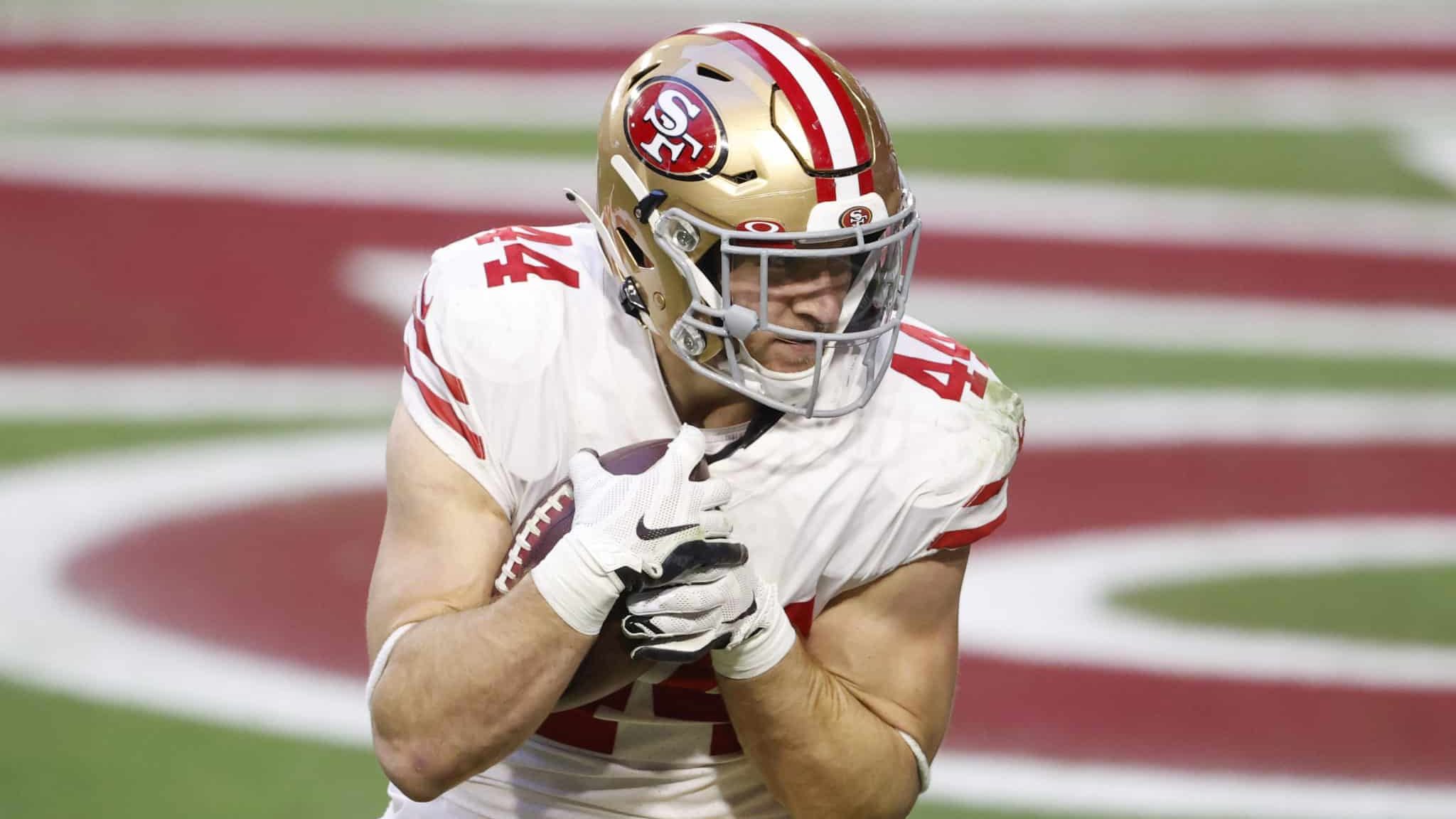 GLENDALE, ARIZONA - DECEMBER 26: Fullback Kyle Juszczyk #44 of the San Francisco 49ers catches a touchdown pass during the second half against the Arizona Cardinals at State Farm Stadium on December 26, 2020 in Glendale, Arizona.
