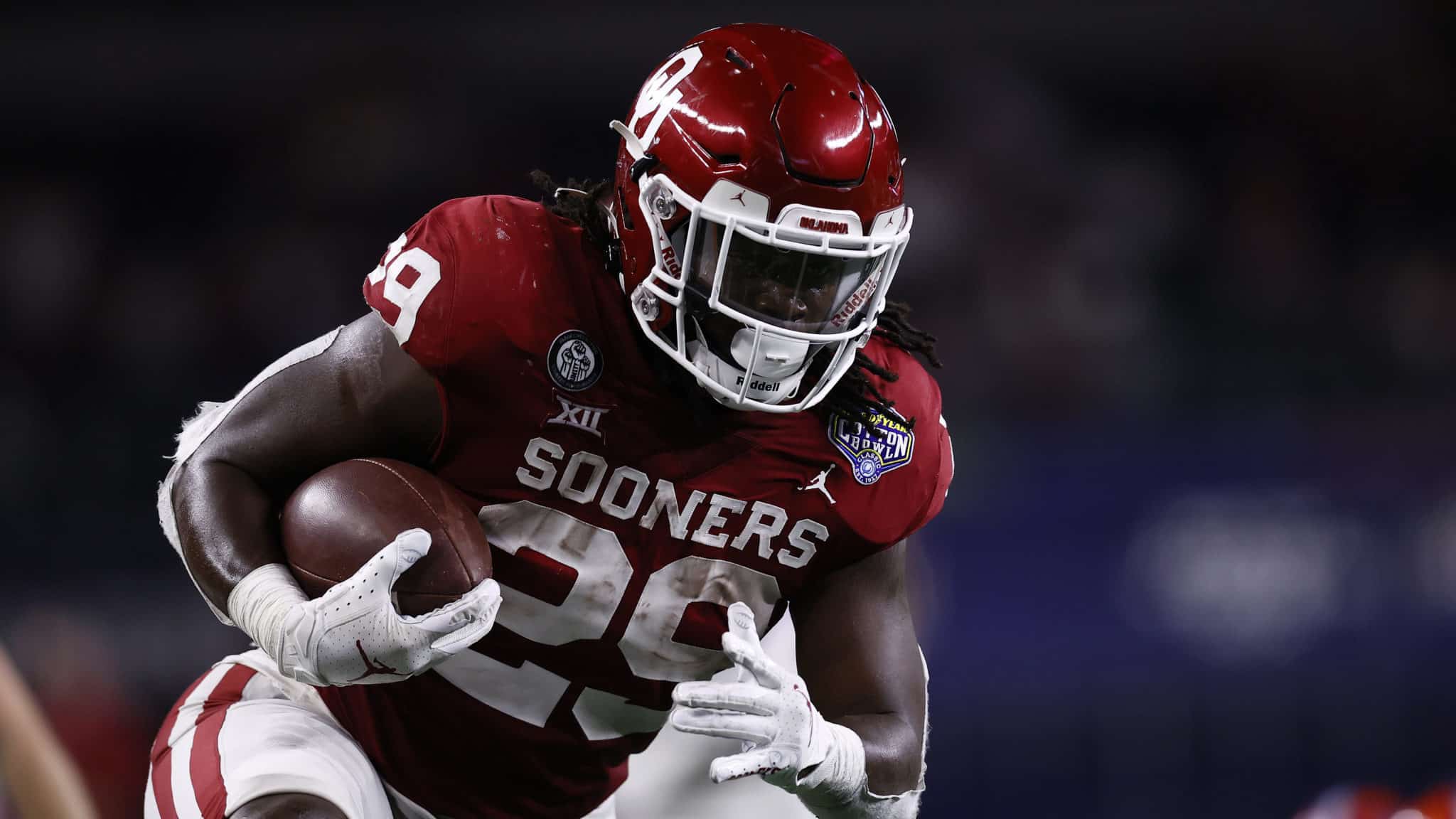 ARLINGTON, TEXAS - DECEMBER 30: Running back Rhamondre Stevenson #29 of the Oklahoma Sooners runs for a touchdown against the Florida Gators during the third quarter at AT&T Stadium on December 30, 2020 in Arlington, Texas.