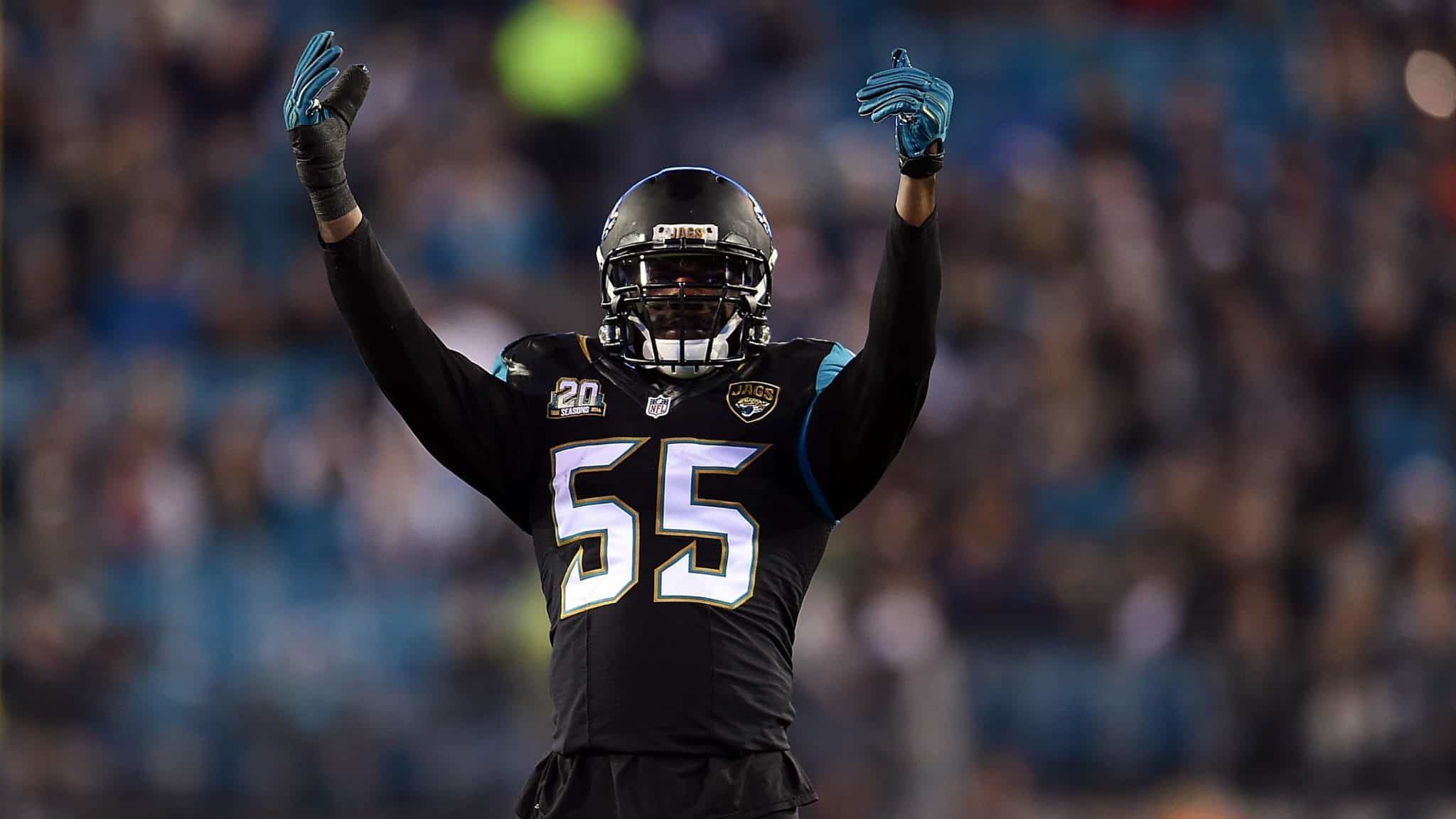 JACKSONVILLE, FL - DECEMBER 18: Geno Hayes #55 of the Jacksonville Jaguars reacts to a stop against the Tennessee Titans at EverBank Field on December 18, 2014 in Jacksonville, Florida. Jacksonville won the game 21-13.