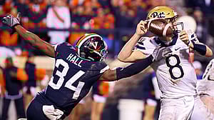 CHARLOTTESVILLE, VA - NOVEMBER 02: Bryce Hall #34 of the Virginia Cavaliers disrupts a pass by Kenny Pickett #8 of the Pittsburgh Panthers in the second half during a game at Scott Stadium on November 2, 2018 in Charlottesville, Virginia.