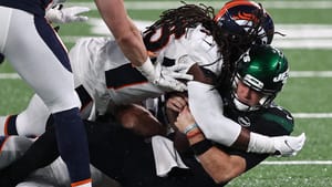 EAST RUTHERFORD, NEW JERSEY - OCTOBER 01: A.J. Johnson #45 of the Denver Broncos sacks Sam Darnold #14 of the New York Jets during the third quarter at MetLife Stadium on October 01, 2020 in East Rutherford, New Jersey.