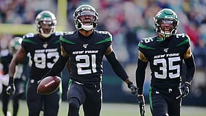 EAST RUTHERFORD, NEW JERSEY - DECEMBER 08: Nate Hairston #21 and Kyron Brown #35 of the New York Jets celebrate Hairston's interception during the first half of their game against the Miami Dolphins at MetLife Stadium on December 08, 2019 in East Rutherford, New Jersey.