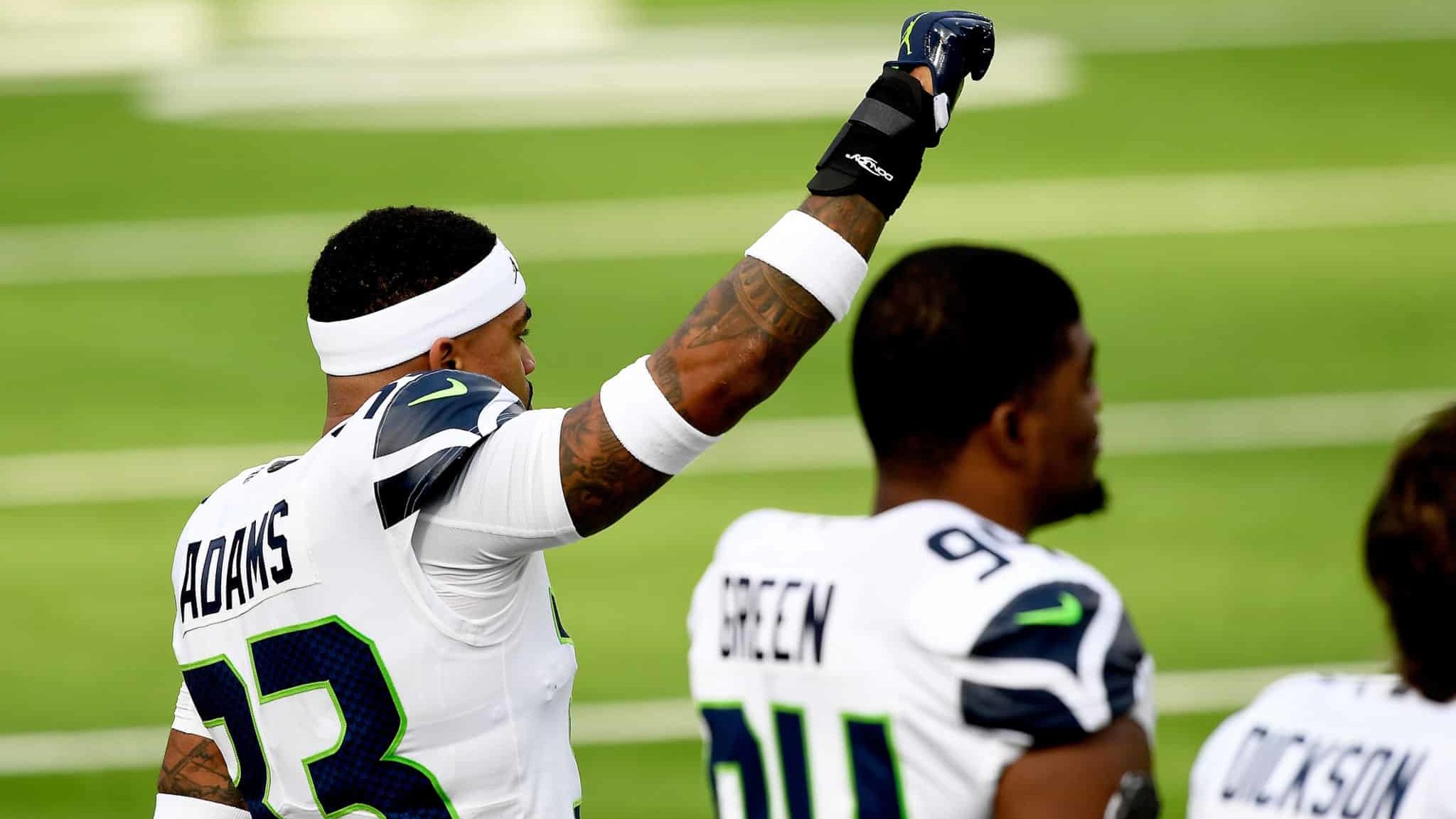 INGLEWOOD, CALIFORNIA - NOVEMBER 15: Jamal Adams #33 of the Seattle Seahawks gestures during the National Anthem before their game against the Los Angeles Rams at SoFi Stadium on November 15, 2020 in Inglewood, California.