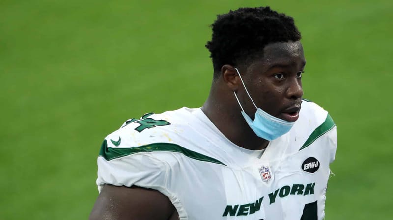 INGLEWOOD, CALIFORNIA - NOVEMBER 22: Folorunso Fatukasi #94 of the New York Jets walks off the field after the game against the Los Angeles Chargers at SoFi Stadium on November 22, 2020 in Inglewood, California.