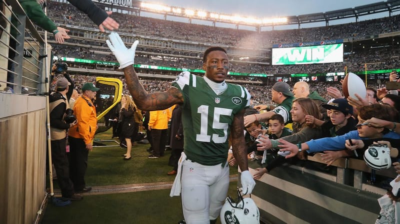 EAST RUTHERFORD, NJ - DECEMBER 27: Wide Receiver Brandon Marshall #15 of the New York Jets greets fans after the game against the New England Patriots at MetLife Stadium on December 27, 2015 in East Rutherford, New Jersey.