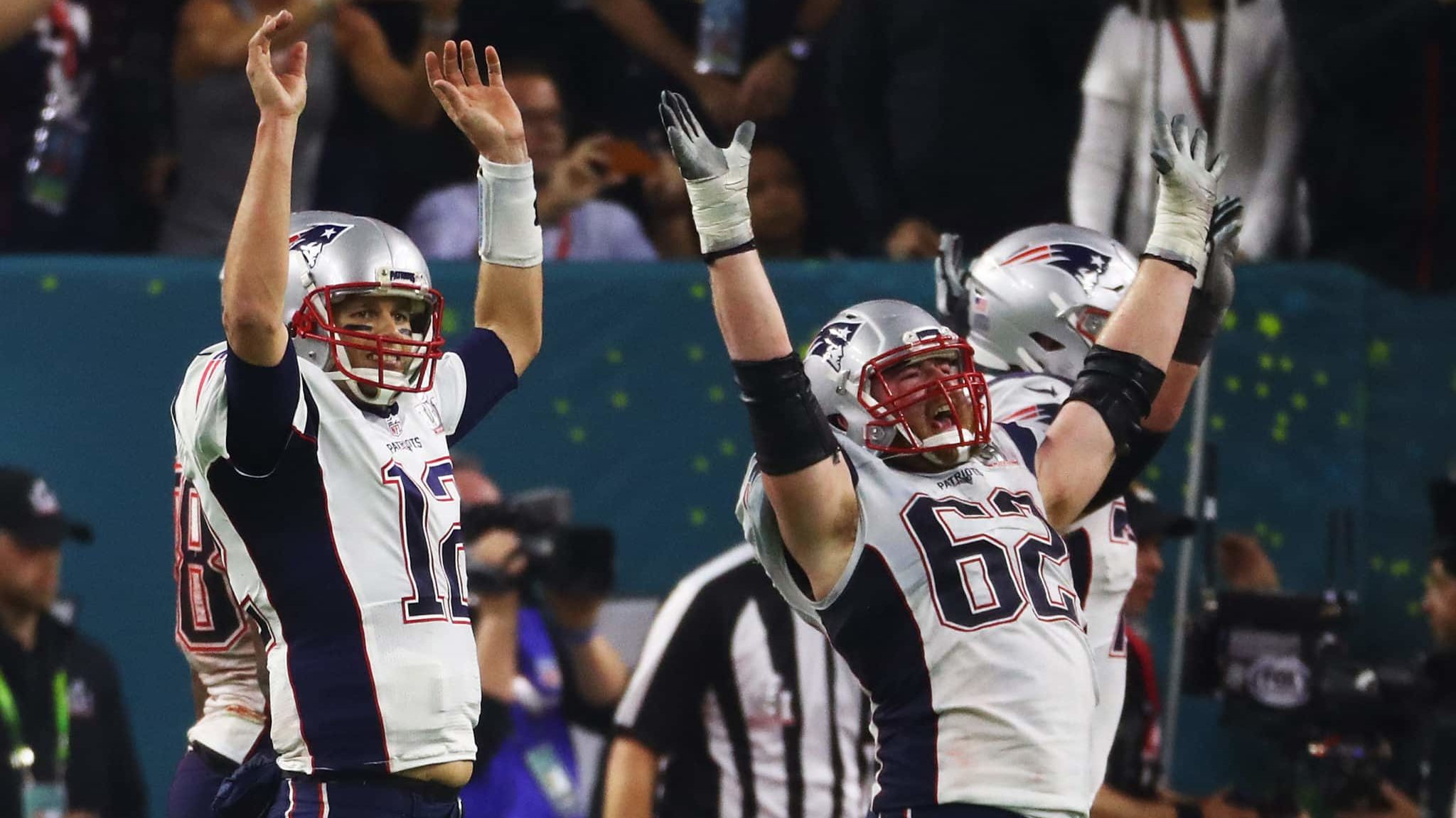 HOUSTON, TX - FEBRUARY 05: Tom Brady #12 and Joe Thuney #62 of the New England Patriots celebrate a 34-28 overtime win against the Atlanta Falcons during Super Bowl 51 at NRG Stadium on February 5, 2017 in Houston, Texas.