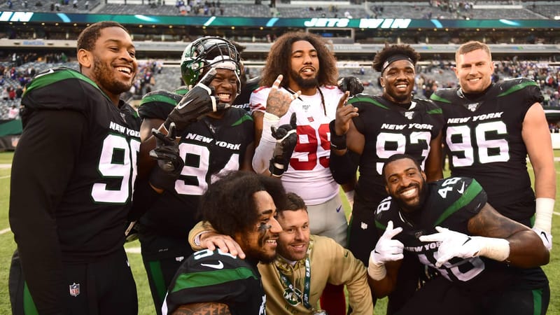 EAST RUTHERFORD, NEW JERSEY - NOVEMBER 10: Leonard Williams #99 of the New York Giants poses with his former teammates of the New York Jets following their game at MetLife Stadium on November 10, 2019 in East Rutherford, New Jersey.
