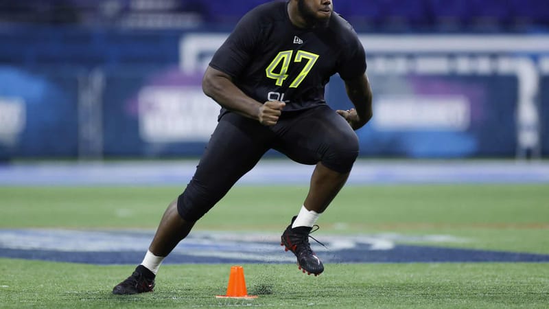 INDIANAPOLIS, IN - FEBRUARY 28: Offensive lineman Andrew Thomas of Georgia runs a drill during the NFL Combine at Lucas Oil Stadium on February 28, 2020 in Indianapolis, Indiana.