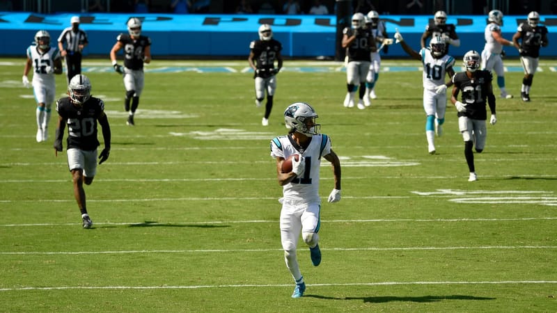 CHARLOTTE, NORTH CAROLINA - SEPTEMBER 13: Robby Anderson #11 of the Carolina Panthers breaks free for a touchdown against the Las Vegas Raiders at Bank of America Stadium on September 13, 2020 in Charlotte, North Carolina. Las Vegas won 34-30.