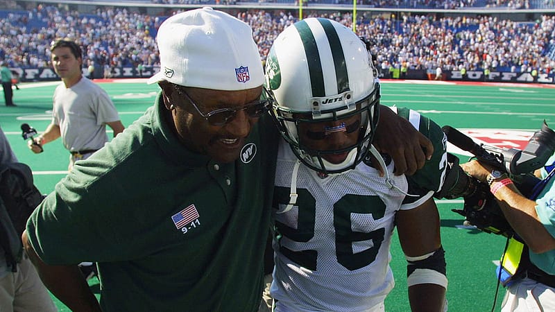 ORCHARD PARK, NY - SEPTEMBER 8: Running back Chad Morton #26 of the New York Jets walks off the field with a coach after his kickoff return abruptly ended the NFL game against the Buffalo Bills on September 8, 2002 at Ralph Wilson Stadium in Orchard Park, New York. The Jets won in overtime 37-31.