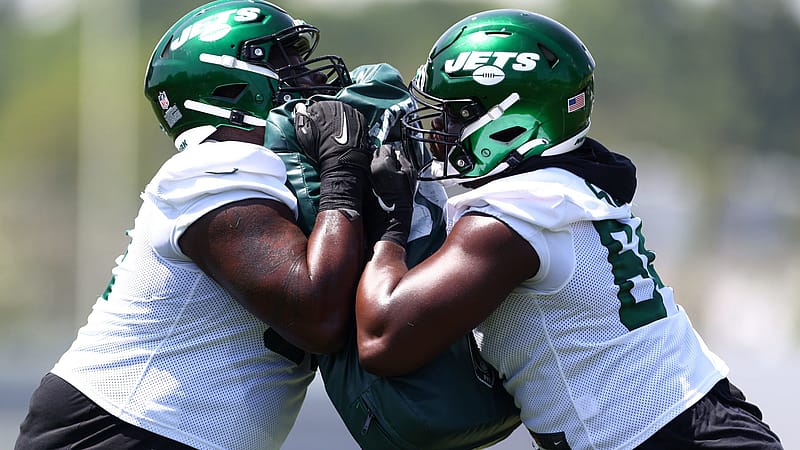 FLORHAM PARK, NJ - JUNE 15: Offensive linemen Derrick Kelly #62 and Greg Senat #64 of the New York Jets during New York Jets mandatory minicamp at Atlantic Health Jets Training Center on June 15, 2022 in Florham Park, New Jersey.