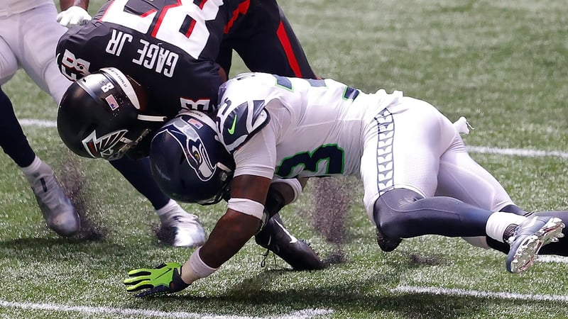 ATLANTA, GEORGIA - SEPTEMBER 13: Jamal Adams #33 of the Seattle Seahawks tackles Russell Gage #83 of the Atlanta Falcons after a reception in the first half at Mercedes-Benz Stadium on September 13, 2020 in Atlanta, Georgia.