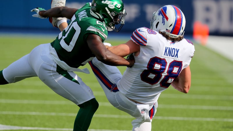 ORCHARD PARK, NY - SEPTEMBER 13: Dawson Knox #88 of the Buffalo Bills makes a catch as Marcus Maye #20 of the New York Jets makes the tackle during the second half at Bills Stadium on September 13, 2020 in Orchard Park, New York. Bills beat the Jets 27 to 17.