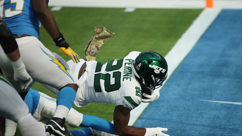 INGLEWOOD, CALIFORNIA - NOVEMBER 22: La'Mical Perine #22 of the New York Jets stretches into the end zone for a touchdown during the first half against the Los Angeles Chargers at SoFi Stadium on November 22, 2020 in Inglewood, California.