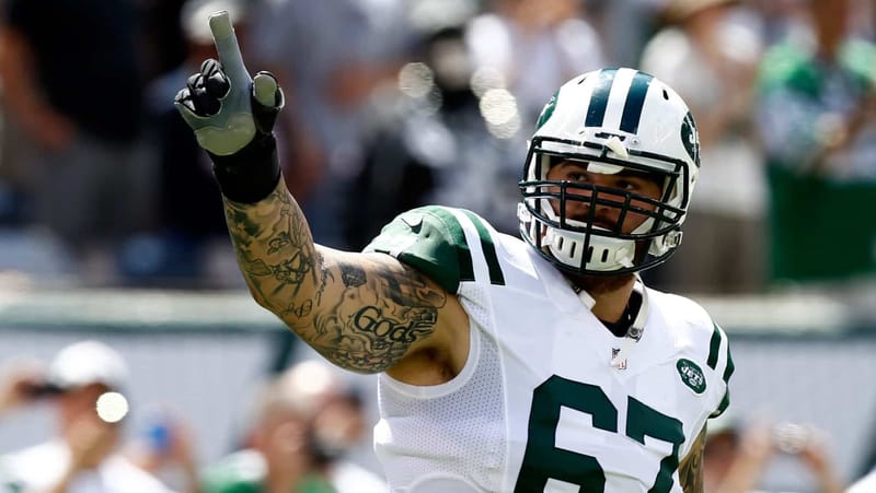 EAST RUTHERFORD, NJ - SEPTEMBER 07: Brian Winters #67 of the New York Jets is introduced before a game against the Oakland Raiders at MetLife Stadium on September 7, 2014 in East Rutherford, New Jersey.