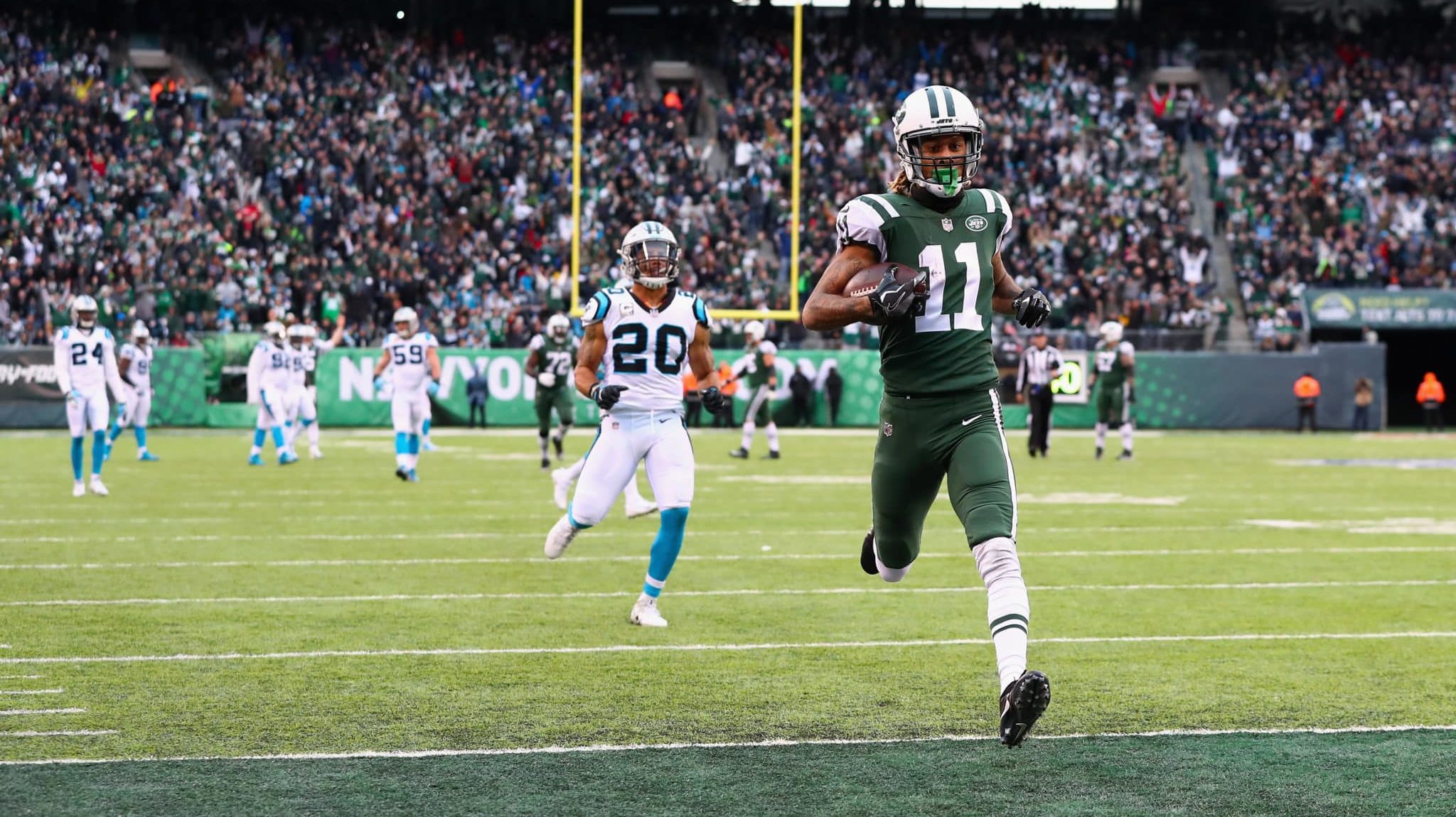 EAST RUTHERFORD, NJ - NOVEMBER 26: Wide receiver Robby Anderson #11 of the New York Jets scores a touchdown during the third quarter of the game at MetLife Stadium on November 26, 2017 in East Rutherford, New Jersey.