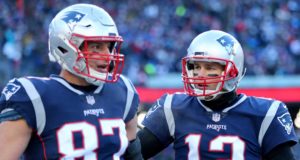 FOXBOROUGH, MASSACHUSETTS - JANUARY 13: Tom Brady #12 of the New England Patriots and Rob Gronkowski #87 react during the second quarter in the AFC Divisional Playoff Game against the Los Angeles Chargers at Gillette Stadium on January 13, 2019 in Foxborough, Massachusetts.