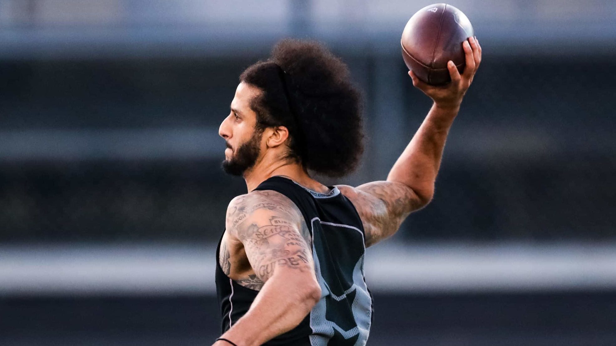 RIVERDALE, GA - NOVEMBER 16: Colin Kaepernick looks to pass during his NFL workout held at Charles R Drew high school on November 16, 2019 in Riverdale, Georgia.