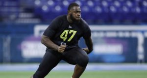 INDIANAPOLIS, IN - FEBRUARY 28: Offensive lineman Andrew Thomas of Georgia runs a drill during the NFL Combine at Lucas Oil Stadium on February 28, 2020 in Indianapolis, Indiana.