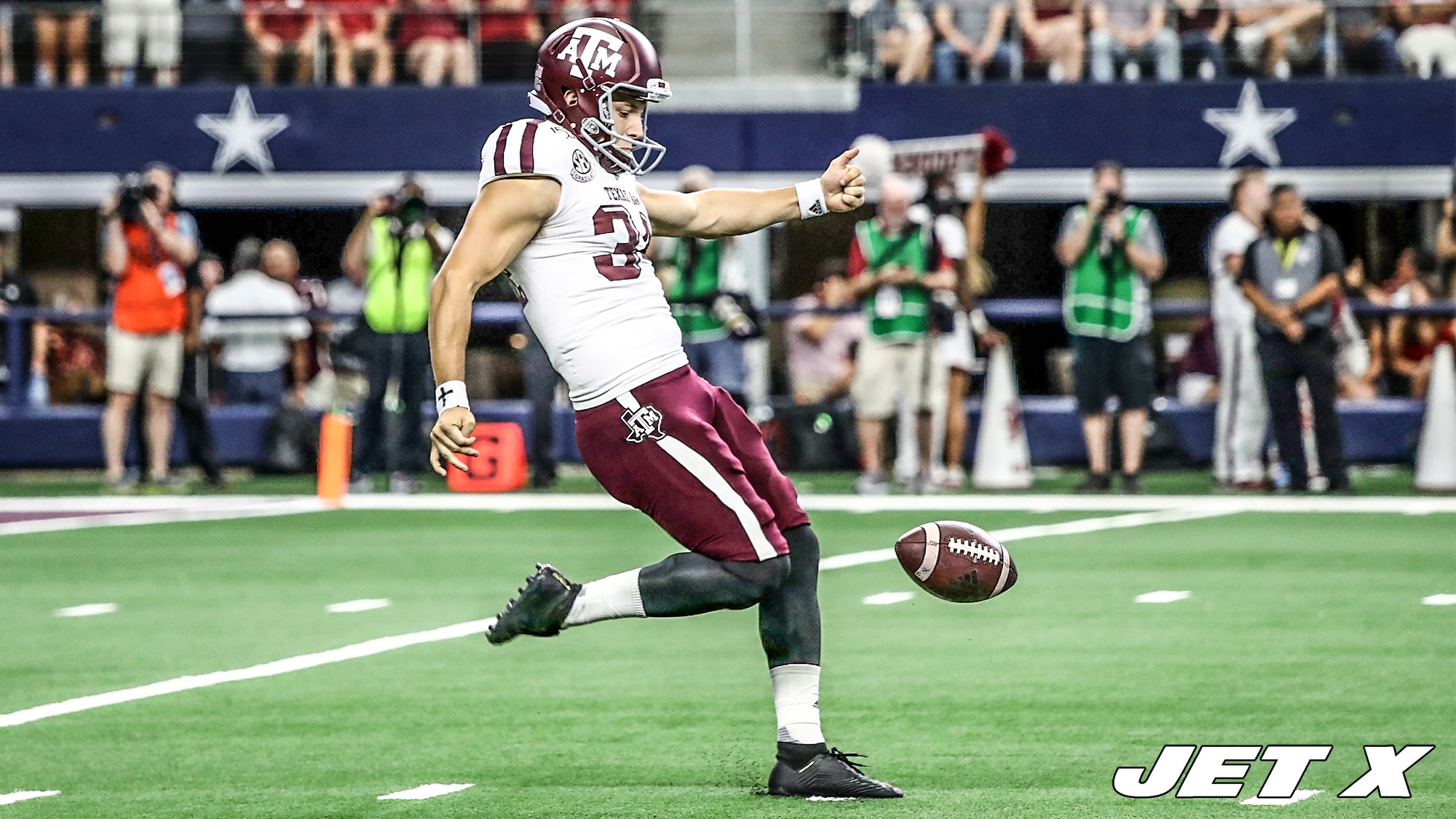 New York Jets punter Braden Mann (7) winds up to kick during the