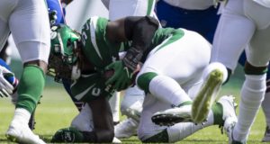 EAST RUTHERFORD, NJ - SEPTEMBER 08: C.J. Mosley #57 of the New York Jets picks up a fumbled snap by the Buffalo Bills during the second quarter at MetLife Stadium on September 8, 2019 in East Rutherford, New Jersey.