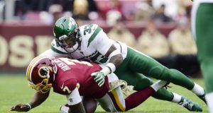 LANDOVER, MD - NOVEMBER 17: Dwayne Haskins #7 of the Washington Redskins is sacked by Jamal Adams #33 of the New York Jets at the end of the first half at FedExField on November 17, 2019 in Landover, Maryland.