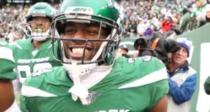 EAST RUTHERFORD, NEW JERSEY - NOVEMBER 24: Brian Poole #34 of the New York Jets celebrates his third quarter interception return for a touchdown against the Oakland Raiders during their game at MetLife Stadium on November 24, 2019 in East Rutherford, New Jersey.