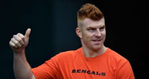 MIAMI, FLORIDA - DECEMBER 22: Andy Dalton #14 of the Cincinnati Bengals gestures to the fans prior to the game against the Miami Dolphins at Hard Rock Stadium on December 22, 2019 in Miami, Florida.