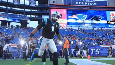 FOXBORO, MA - AUGUST 22: Cam Newton #1 of the Carolina Panthers runs onto the field before a preseason game with the New England Patriots at Gillette Stadium on August 22, 2014 in Foxboro, Massachusetts.