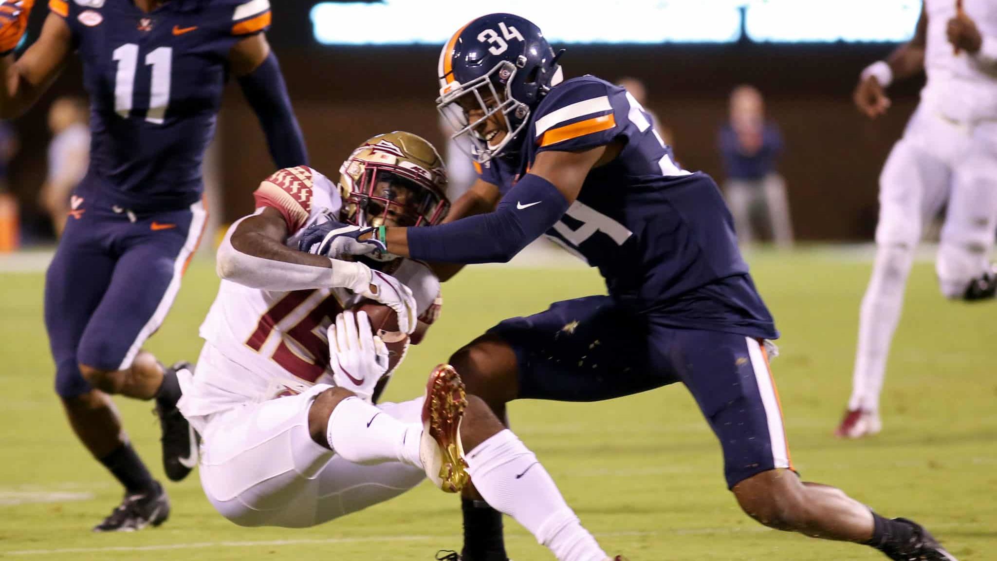 CHARLOTTESVILLE, VA - SEPTEMBER 14: Bryce Hall #34 of the Virginia Cavaliers breaks up a pass intended for Tamorrion Terry #15 of the Florida State Seminoles in the first half during a game at Scott Stadium on September 14, 2019 in Charlottesville, Virginia.