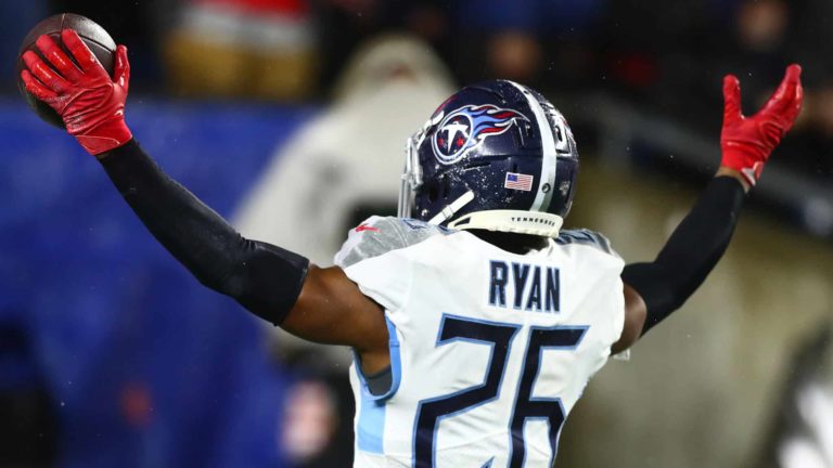 FOXBOROUGH, MASSACHUSETTS - JANUARY 04: Logan Ryan #26 of the Tennessee Titans celebrates his touchdown against the New England Patriots in the fourth quarter of the AFC Wild Card Playoff game at Gillette Stadium on January 04, 2020 in Foxborough, Massachusetts. (Photo by Adam