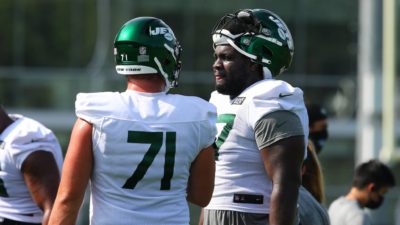 FLORHAM PARK, NEW JERSEY - AUGUST 14: Mekhi Becton #77 of the New York Jets runs drills at Atlantic Health Jets Training Center on August 14, 2020 in Florham Park, New Jersey.
