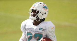 DAVIE, FLORIDA - AUGUST 18: Kalen Ballage #27 of the Miami Dolphins runs through a drill during training camp at Baptist Health Training Facility at Nova Southern University on August 18, 2020 in Davie, Florida.